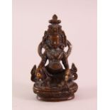 A SNALL 19TH CENTURY TIBETAN BRONZE FIGURE OF JAMBHALA, holding a mongoose, 9.5cm.