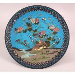A JAPANESE CLOISONNE CIRCULAR DISH, decorated with quails by a stream, 30cm diameter.
