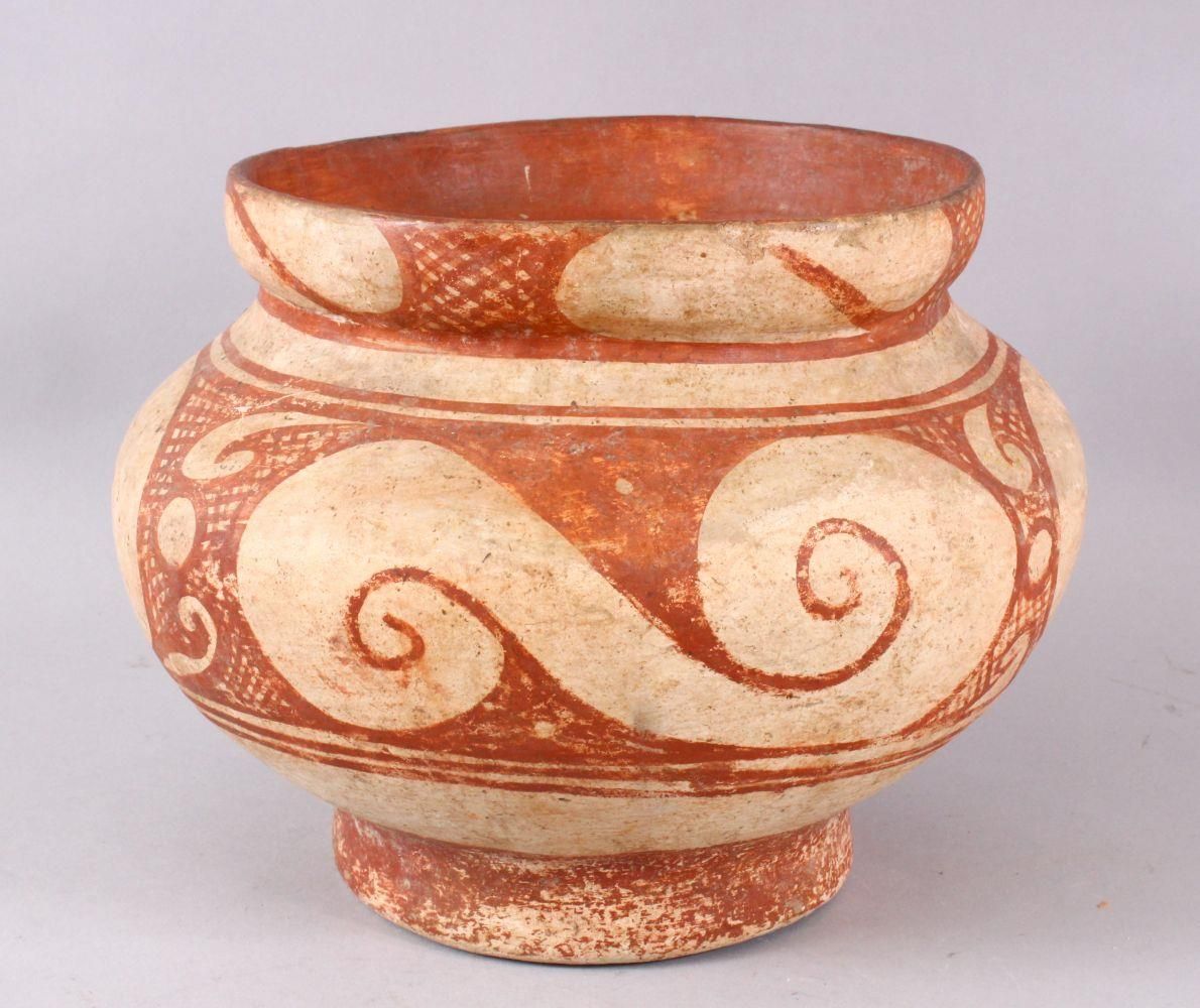 AN EARLY THAI BAN CHIANG POTTERY VASE, with stylized wave decoration, 25cm diameter x 19cm high