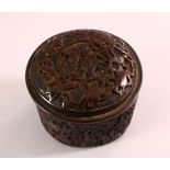 A CHINESE SMALL CIRCULAR CINNABAR LACQUER STYLE BOX AND COVER, decorated with figures in a