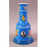 A PERSIAN QAJAR PORCELAIN HUQQA BASE, with ablue ground and figural decoration around flora, 23cm