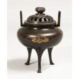A CHINESE TWO HANDLED BRONZE CENSER AND COVER, 5ins high.