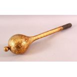 A TURKISH OTTOMAN GILDED METAL MACE, with chased decoration and a wooden handle, 51cm