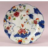 AN 18TH CENTURY CHINESE QIANLONG PERIOD TOBACCO LEAF PORCELAIN PLATE, 23cm.