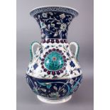 A LARGE TURKISH OTTOMAN STYLE CERAMIC FLORAL LAMP VASE, with three moulded handles and three bosses,
