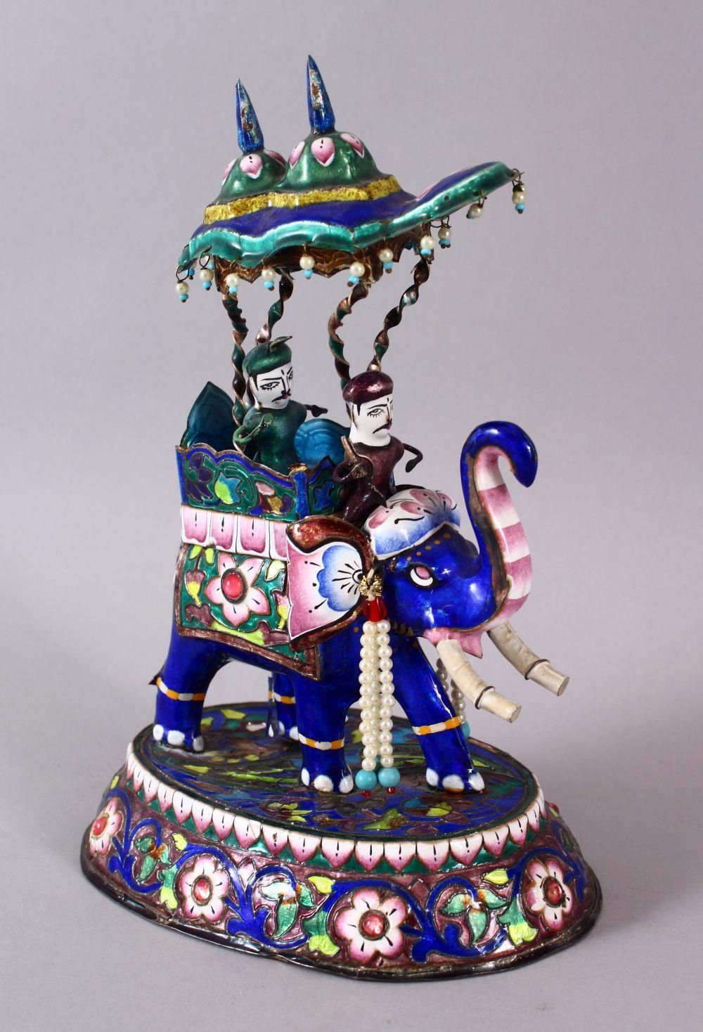 A 19TH / 20TH CENTURY INDIAN SILVER & ENAMEL MODEL OF AN ELEPHANT AND FIGURES, the elephant carrying