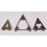 AN ISLAMIC STEEL BUILDING TRIANGLE, together with two others formed of brass, 17cm down to 11cm