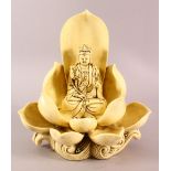 A CHINESE BLANC DE CHINE FIGURE OF GUANYIN & LOTUS, the body with a yellow hue, the verso with a