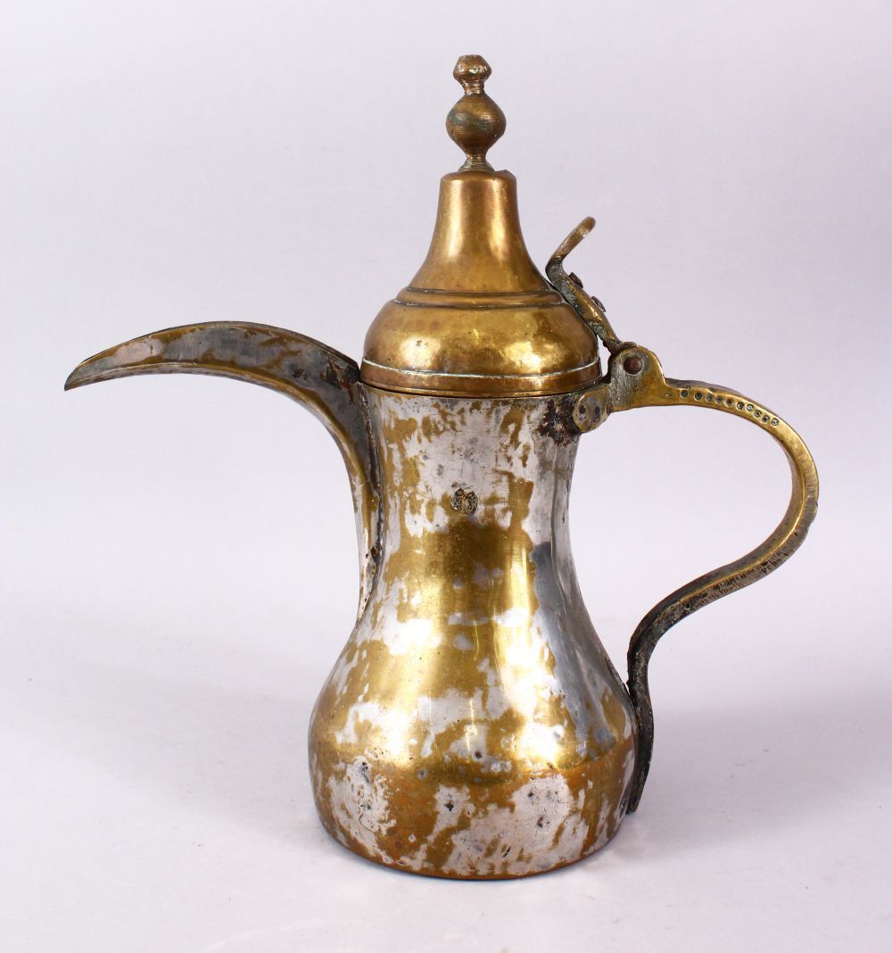 AN 19TH CENTURY ISLAMIC SILVERED BRASS SIGNED DALLAH / COFFEE POT, with an impressed signature to