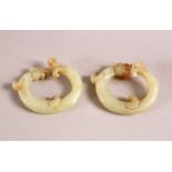 A CHINESE CARVED JADE TWO DRAGON LINK RING, 4cm each.