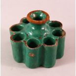 A MORROCAN / FEZ POTTERY INK STAND, with a green glaze, 11.5cm