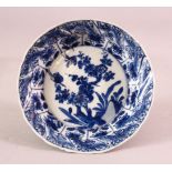 A SMALL CHINESE KANGXI PERIOD BLUE & WHITE PORCELAIN SAUCER DISH, with floral decoration the base