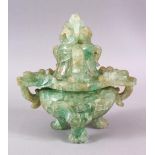 A CHINESE CARVED GREEN QUARTZ TWIN HANDLE VASE AND COVER, with lion dog carved finial's, upon tripod