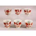 A SET OF SIX ARITA PORCELAIN CUPS, each painted with iron red bird amongst flowers, each approx. 7cm