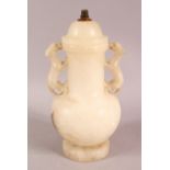 A CHINESE STYLE WHITE ONYX CARVED LIDDED VASE / LAMP, with twin moulded beast handles, overall 26.