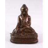 A BRONZE BUDDHA with glass inset eyes, 16cm high.