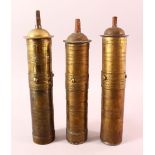 THREE 19TH CENTURY TURKISH BRASS CYLINDRICAL COFFEE GRINDERS, approx. 30cm high.