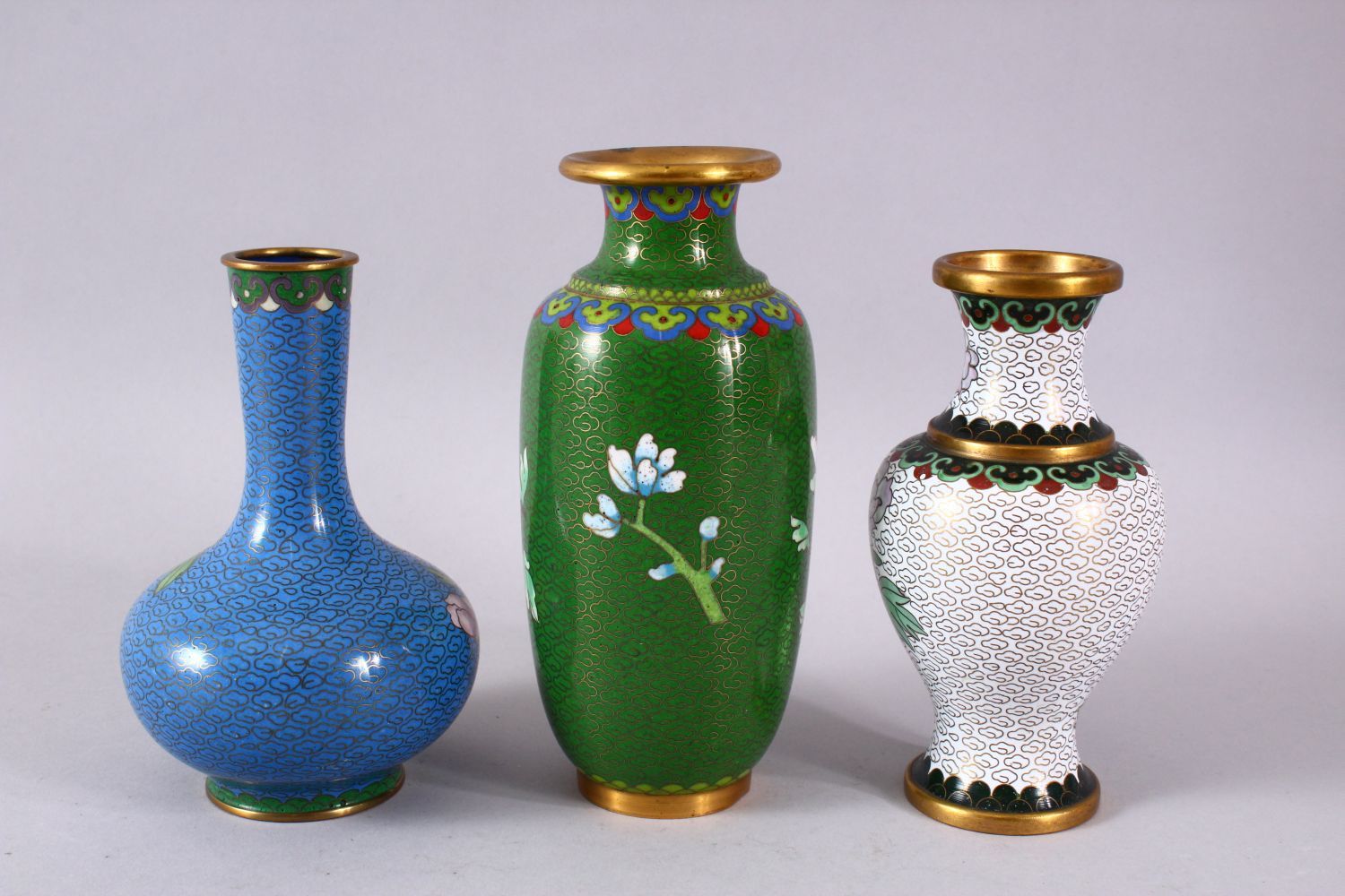 A MIXED LOT OF THREE CHINESE CLOISONNE VASES - the largest with a green ground with native Lotus - Image 6 of 8
