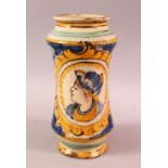 A GOOD EUROPEAN SUBJECT POTTERY MEDICINE JAR, decorated with a figure and flora, 23.5cm