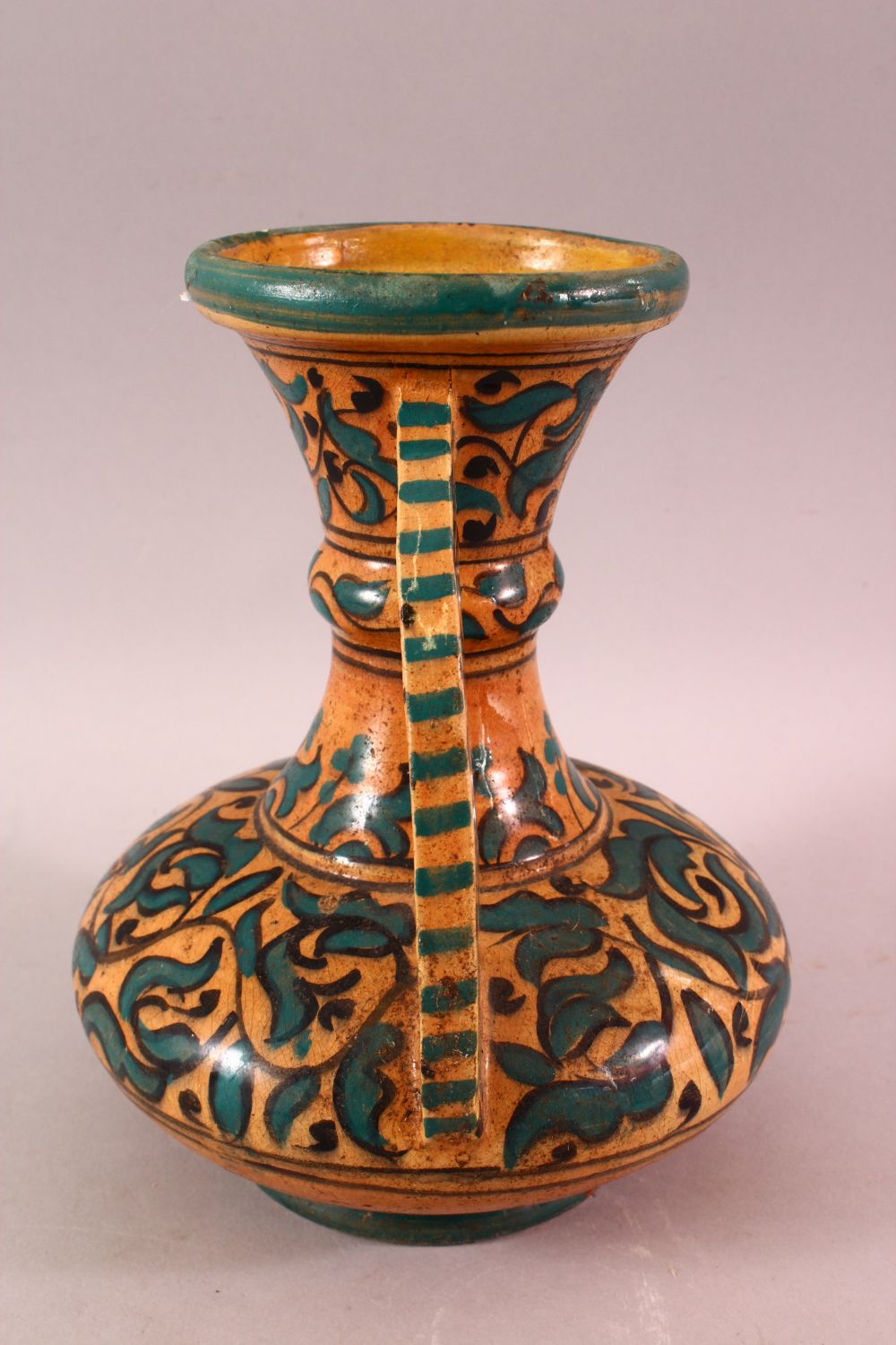 A MOROCCAN POTTERY FLORAL VASE - SIGNED BY BIN JALAL, with twin handles and green foliage - Image 4 of 8