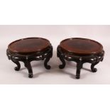 A PAIR OF 19TH CENTURY CHINESE CARVED HARDWOOD STANDS. each with five curving feet, 26cm wide