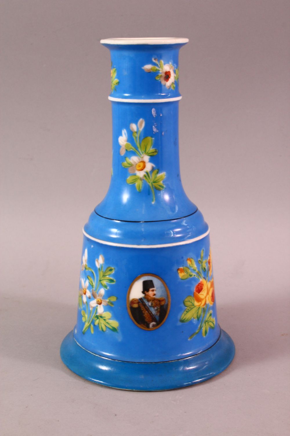 A PERSIAN QAJAR PORCELAIN HUQQA BASE, with ablue ground and figural decoration around flora, 23cm - Image 4 of 7