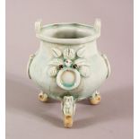 A CHINESE SONG STYLE QING BAI GLAZED CELADON TRIPLE FOOT POT, with twin handles and moulded