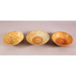 THREE EARLY CHINESE POTTERY BOWLS, of varying style and size (3)