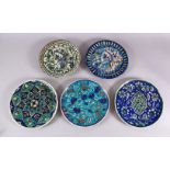 A COLLECTION OF 5 JERUSALEM PALESTINIAN POTTERY PLATES, each with varying decoration of flora and