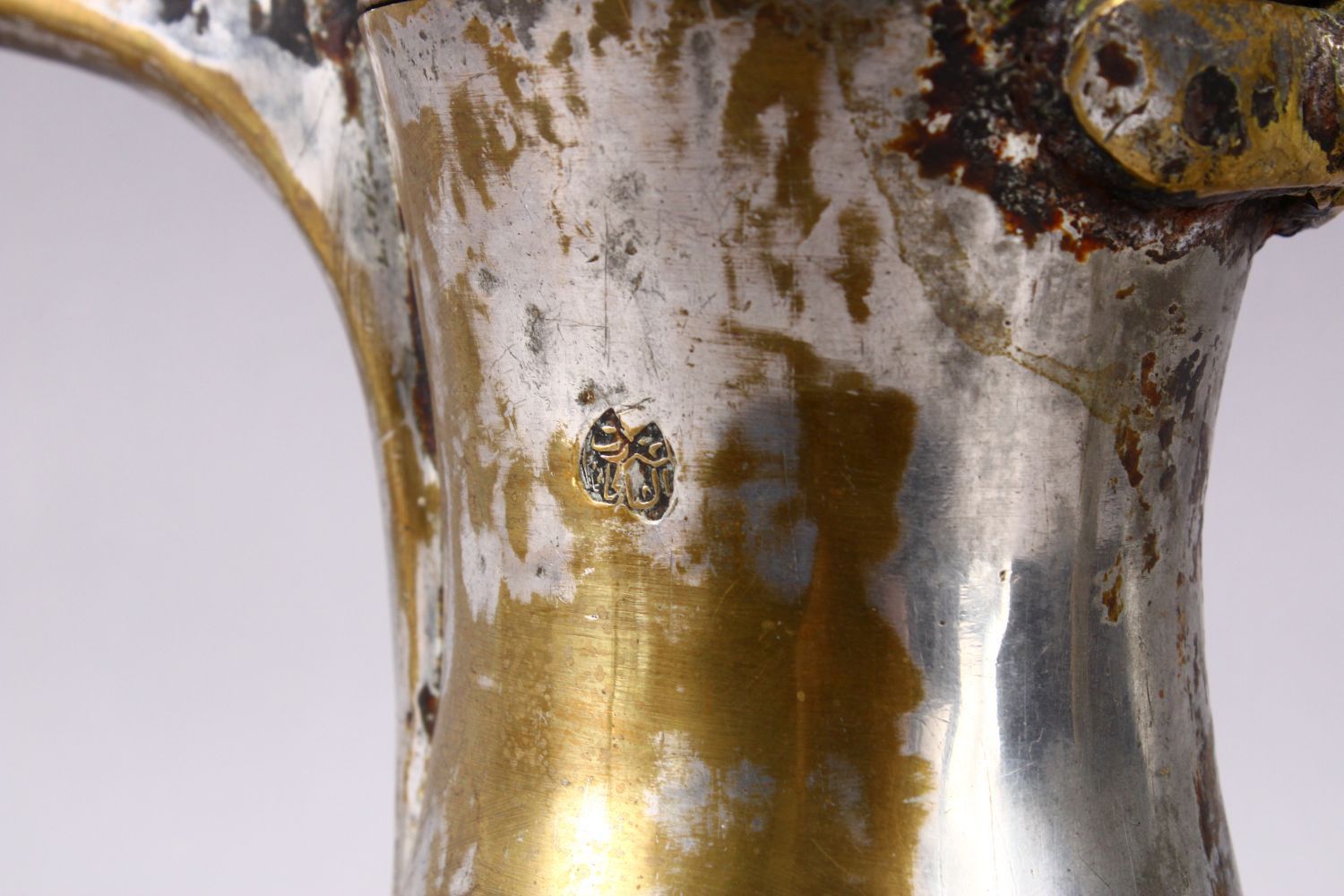 AN 19TH CENTURY ISLAMIC SILVERED BRASS SIGNED DALLAH / COFFEE POT, with an impressed signature to - Image 2 of 5