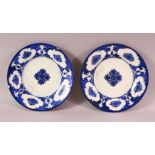 TWO 18TH CENTURY PERSIAN BLUE AND WHITE POTTERY DISHES, 21cm diameter.