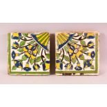 A PAIR OF 17TH/18TH CENTURY PERSIAN SAFAVID POTTERY TILES, each painted with floral sprays, 22cm