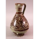 A 14TH CENTURY ISLAMIC RAQQA SYRIA POTTER EWER, drip glaze with brown decoration, 21cm