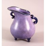 A CHINESE SONG STYLE AUBERGINE GLAZE WINE POT, with tripod feet, the base with a mark, 13cm high.