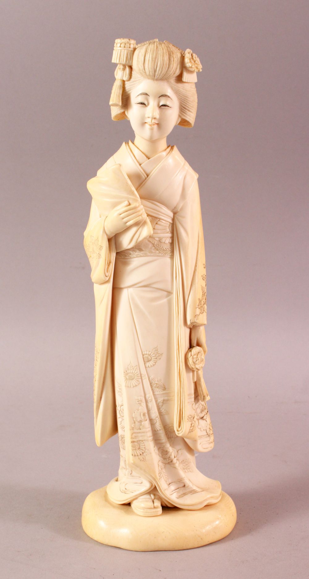 A LARGE AND FINE QUALITY JAPANESE MEIJI PERIOD CARVED ONE PIECE IVORY OKIMONO - BIJIN - the bijin