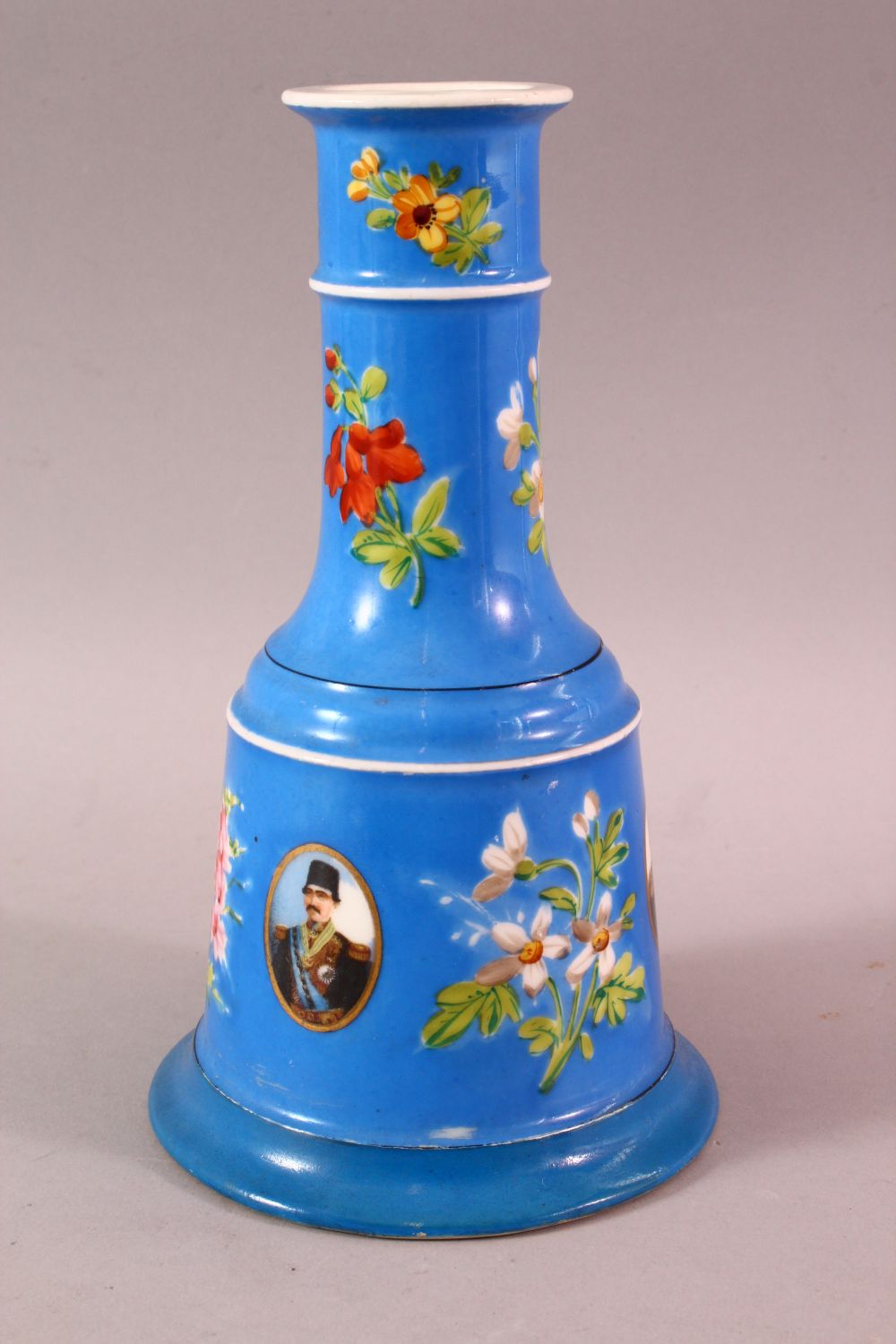 A PERSIAN QAJAR PORCELAIN HUQQA BASE, with ablue ground and figural decoration around flora, 23cm - Image 5 of 7