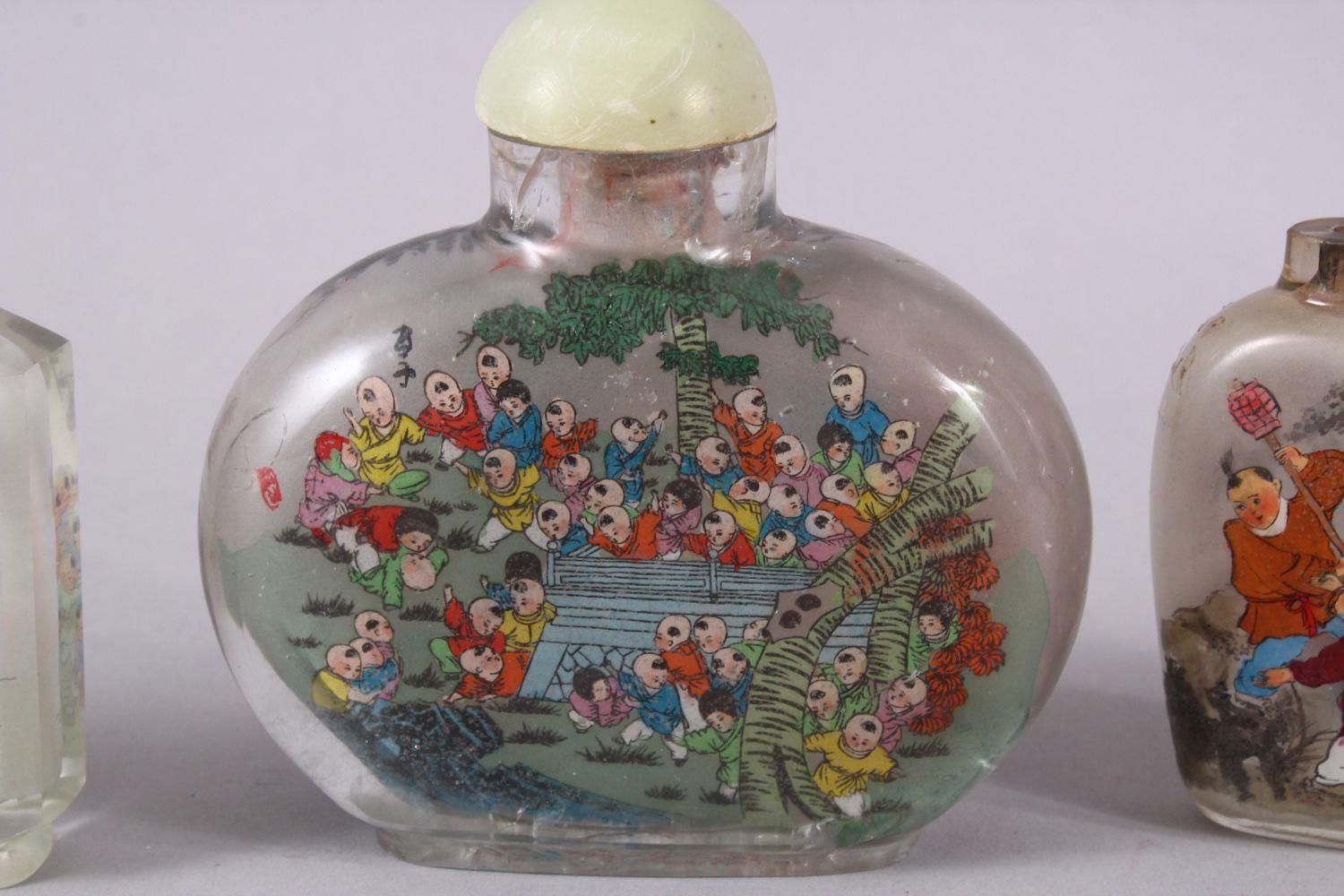 A MIXED LOT OF 5 CHINESE REVERSE PAINTED SNUFF BOTTLES, each with decoration of boys in - Image 3 of 9