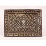 A 19TH CENTURY INDIAN SILVER INLAID BRONZE TRAY, inlaid with silver leaf motif, 23cm