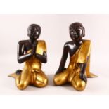 A PAIR OF LARGE THAI / TIBET CARVED WOOD & LACQUER FIGURES, both in knealt positions in gilded