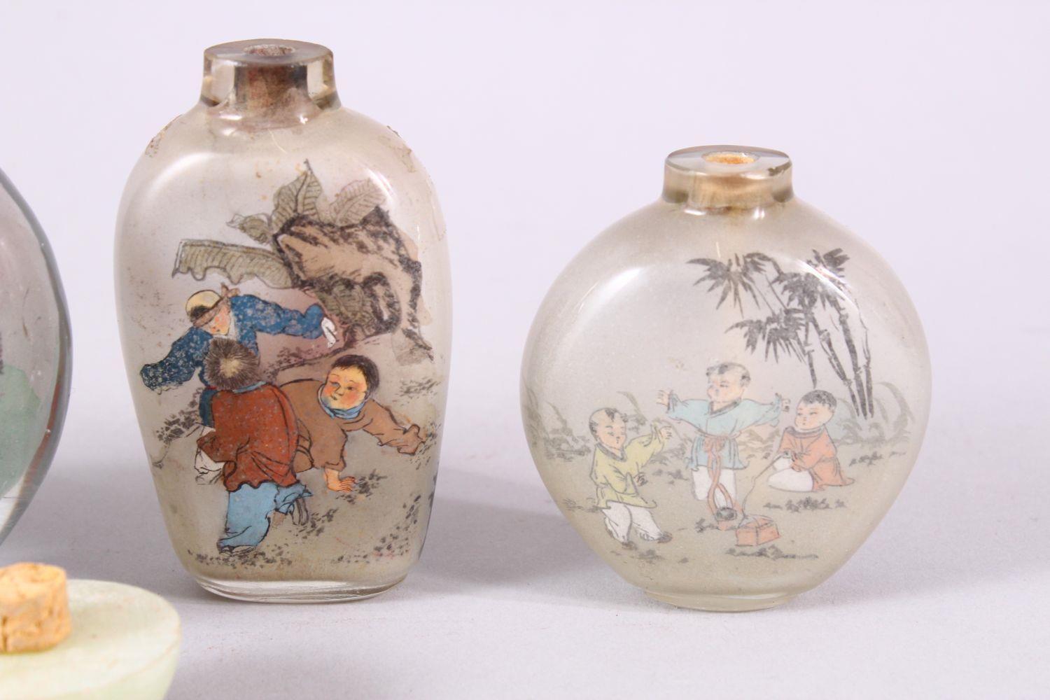 A MIXED LOT OF 5 CHINESE REVERSE PAINTED SNUFF BOTTLES, each with decoration of boys in - Image 8 of 9