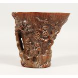 A CARVED HORN LIBATION CUP, 5.5ins.