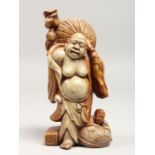 A CHINESE CARVED SOAPSTONE FIGURE, 7.5ins high.