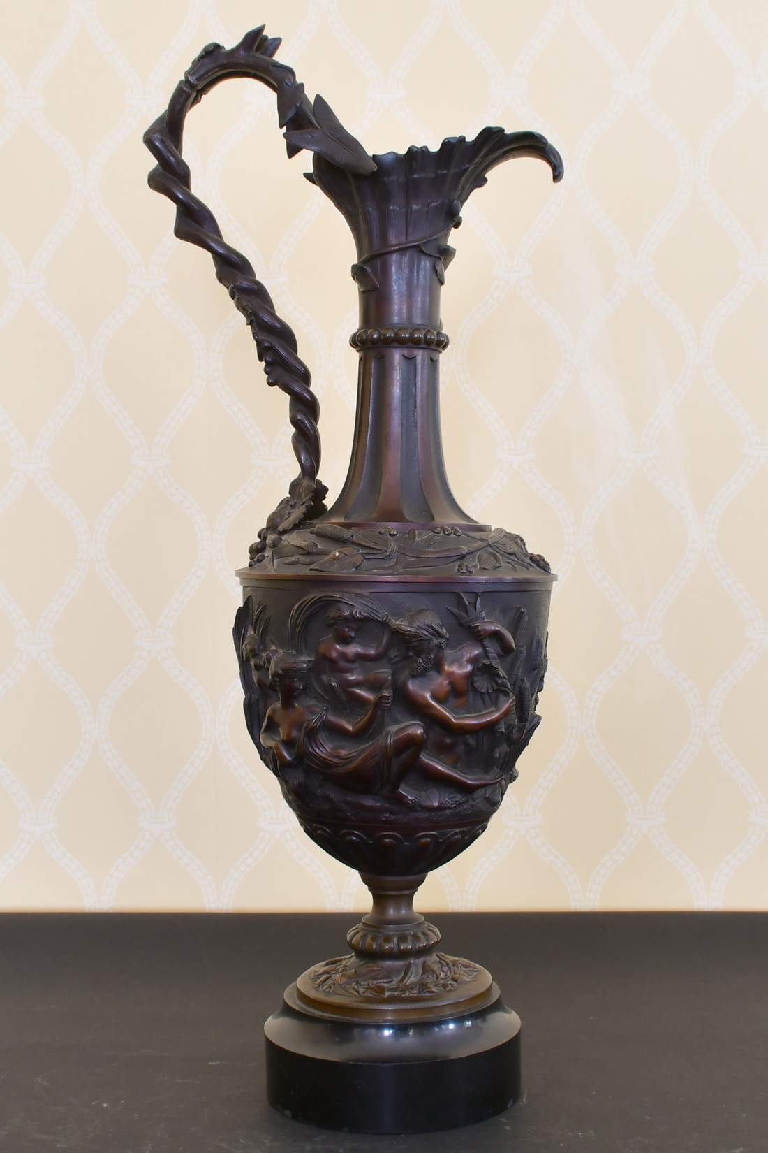 A LARGE 19TH CENTURY CLASSICAL BRONZE EWER of classical form with figures and fruiting vines in