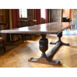 A GOOD OAK REFECTORY TABLE with two plank top, carved cup and cover supports and plain uniting
