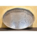 AN OVAL ENGRAVED PLATE TWO-HANDLED TEA TRAY.