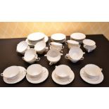 A ROSENTHAL STUDIO-LINE SET OF TWENTY TWO-HANDLED BOWLS AND STANDS, THREE LARGE PLATES AND EIGHT