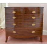 A GEORGIAN MAHOGANY BOWFRONT CHEST of two short and three long graduated drawers with oval brass