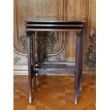 AN EDWARDIAN MAHOGANY NEST OF THREE TABLES.Largest: 1ft 10ins.