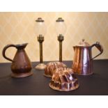 A PAIR OF BRASS LAMPS, JUG AND TWO JELLY MOULDS.