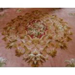 A LARGE FRENCH AUBUSSON WOOL CARPET, Made by TAI PING CARPETS OF HONG KONG, CIRCA. 1990, with pink